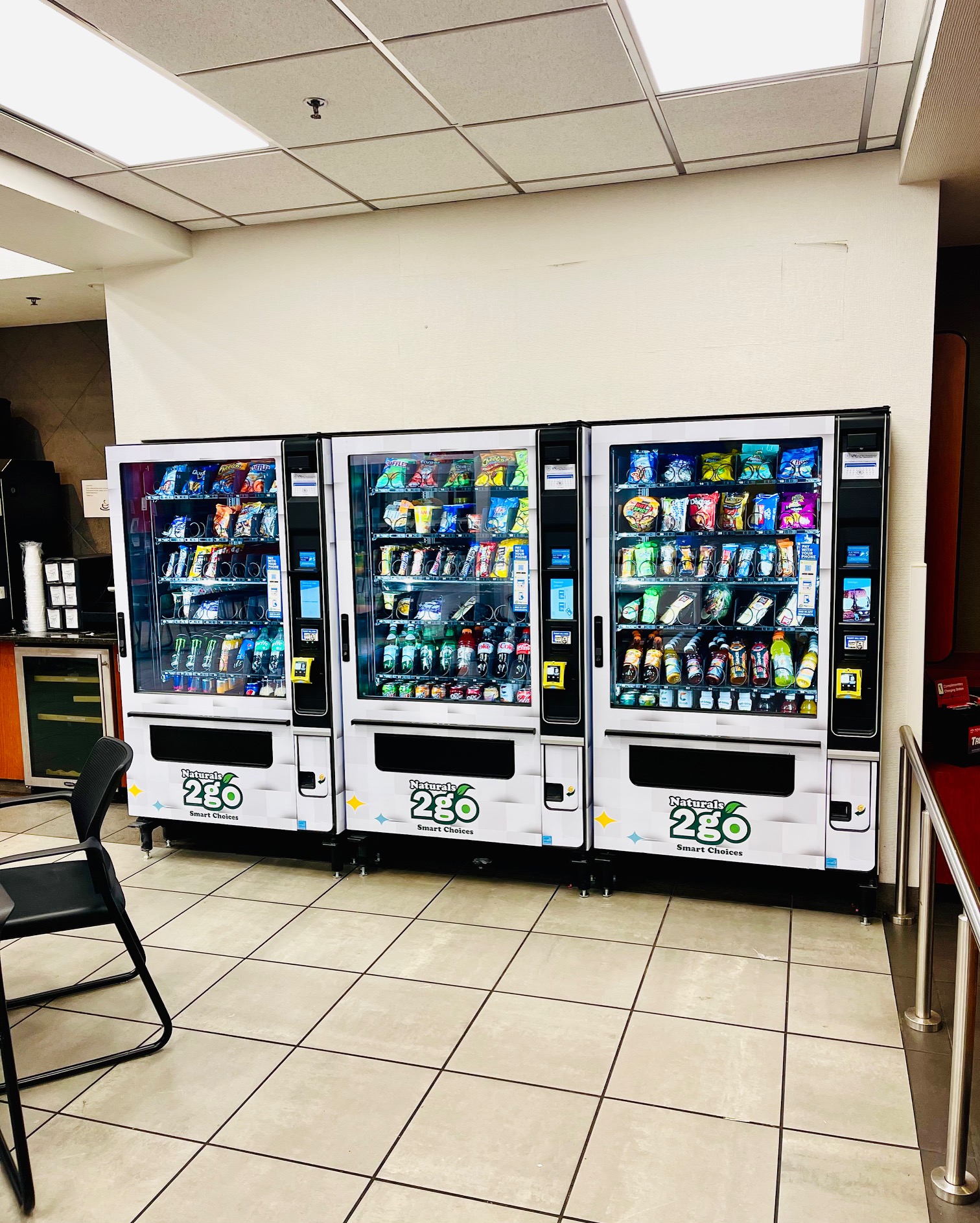 Three vending machines filled with products